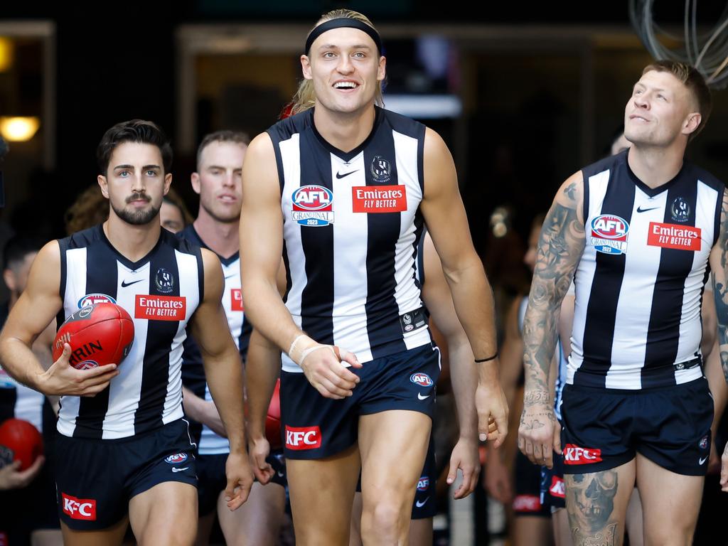 ‘A big rush every time you do it.’ [PLAYERCARD]Darcy Moore[/PLAYERCARD], front and centre, leading Collingwood onto the MCG. Picture: Getty Images