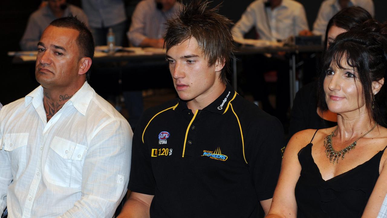 Martin, flanked by dad Shane and mum Kathy during the 2009 national draft where he was picked up by Richmond.