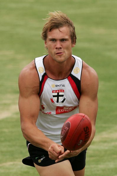 73237738-michael-rix-of-the-saints-handballs-at-a-st-gettyimages.jpg