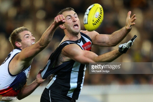452773962-travis-cloke-of-the-magpies-marks-the-ball-gettyimages.jpg