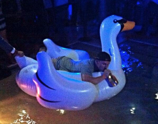 Johnny_Manziel_Riding_Inflatable_Swan_Champagne_Bottle_Picture_Video.jpg