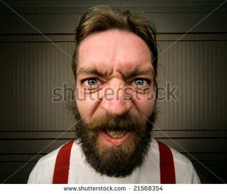 stock-photo-angry-man-with-beard-screws-his-face-up-with-emotion-21568354.jpg