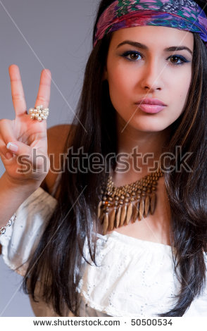 stock-photo-beautiful-and-exotic-young-woman-of-multiple-ethnicity-waiving-peace-sign-with-s-wardrobe-50500534.jpg