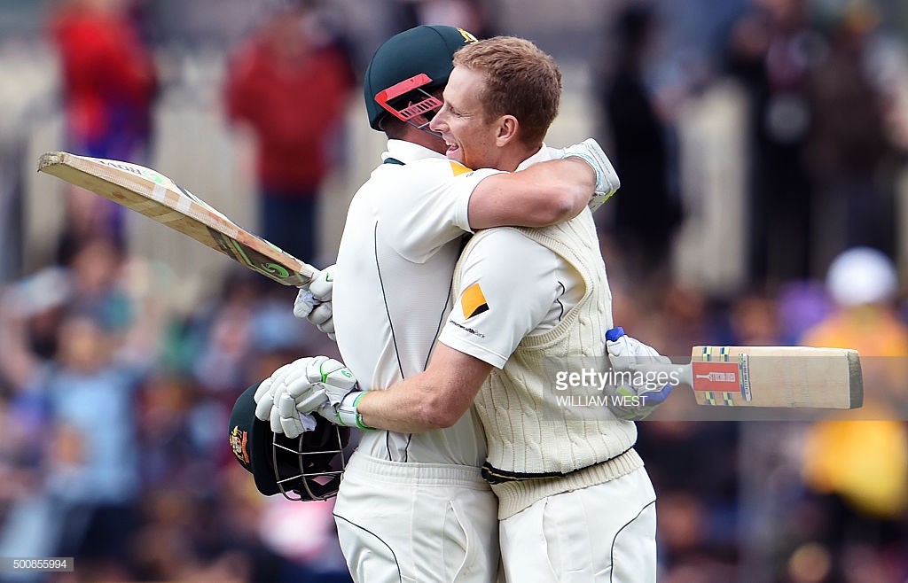 australian-batsman-adam-voges-embraces-teammate-shaun-marsh-after-picture-id500855994