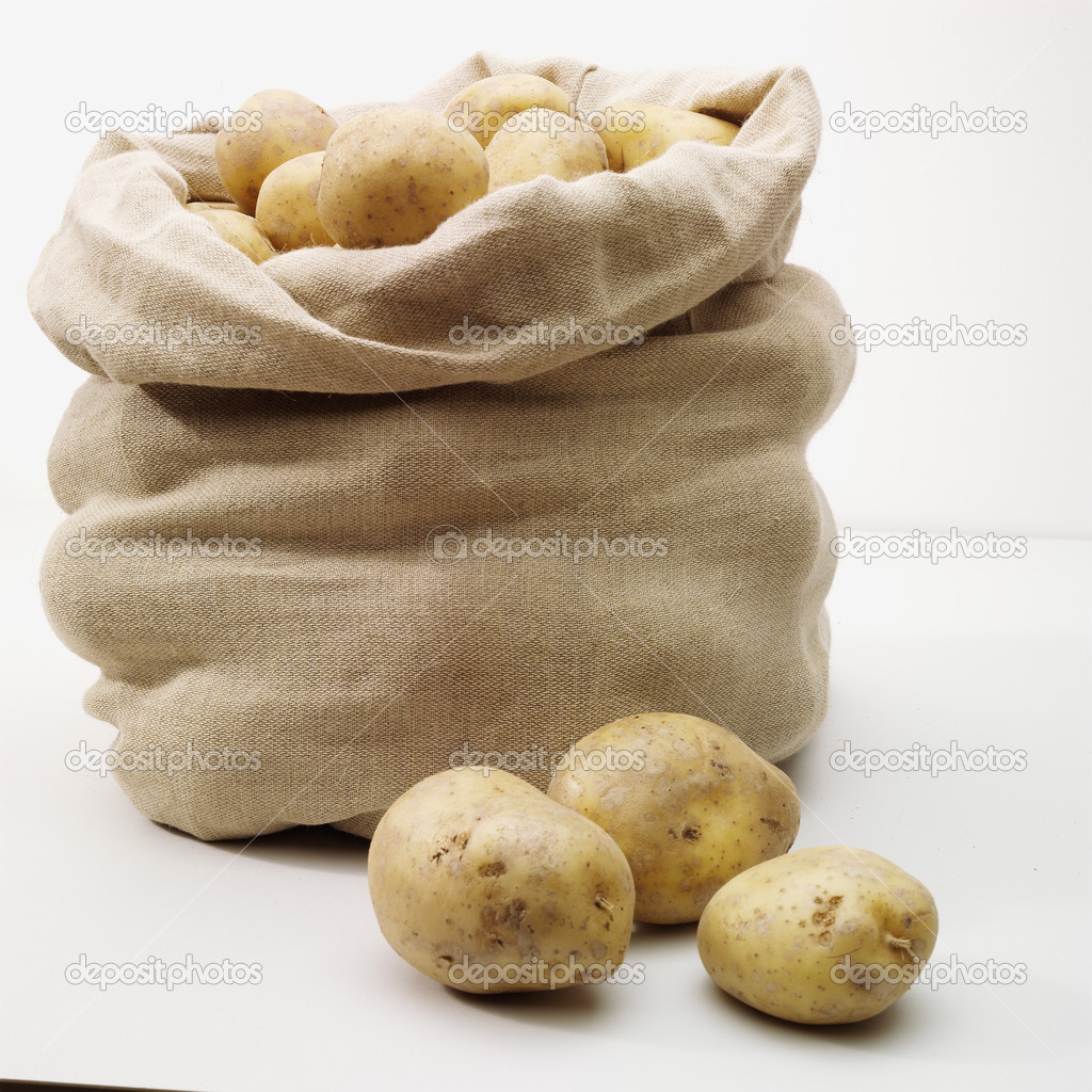 depositphotos_3397960-Overflowing-bag-of-potatoes-on-whit.jpg