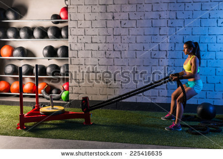 stock-photo-sled-rope-pull-woman-pulling-weights-workout-exercise-225416635.jpg