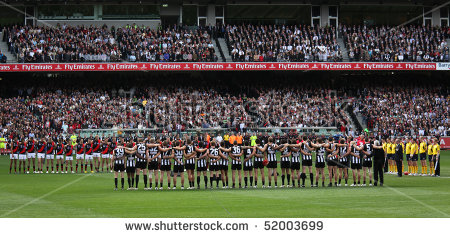 stock-photo-melbourne-april-collingwood-and-essendon-players-line-up-before-the-start-of-their-anzac-day-52003699.jpg