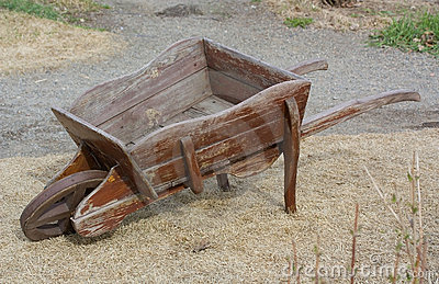 old-empty-wooden-wheelbarrow-14669127.jpg
