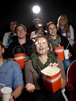 10740785-spectators-eating-popcorn-at-the-movie-theater.jpg