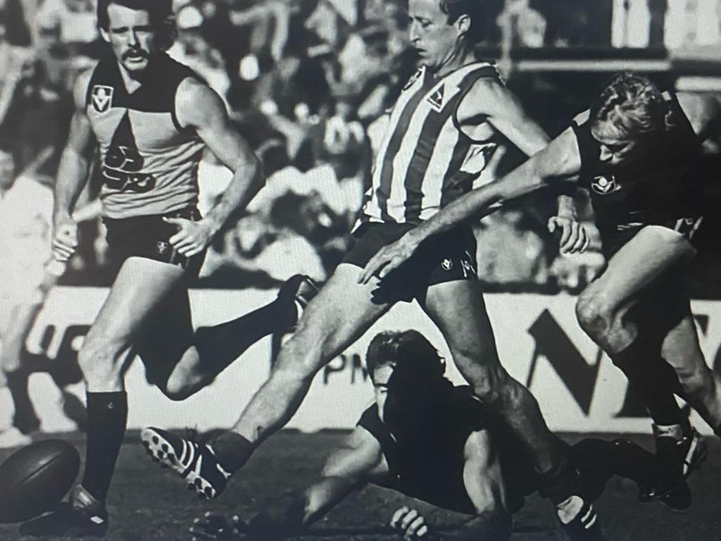 The late Rohan Robertson playing for North Melbourne against the Brisbane Bears in the 1980s.
