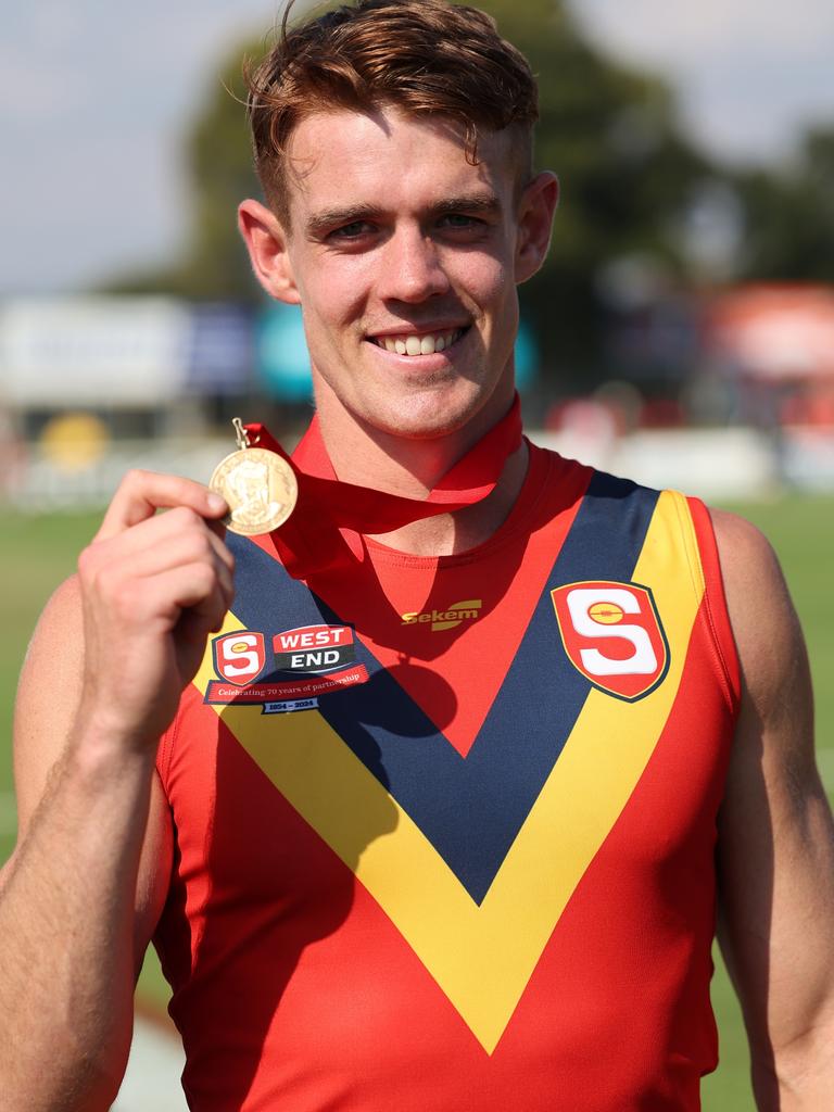 Central District’s Jez McLennan with the Fos Williams Medal as the SANFL’s best player against the VFL this month. Picture: David Mariuz/SANFL