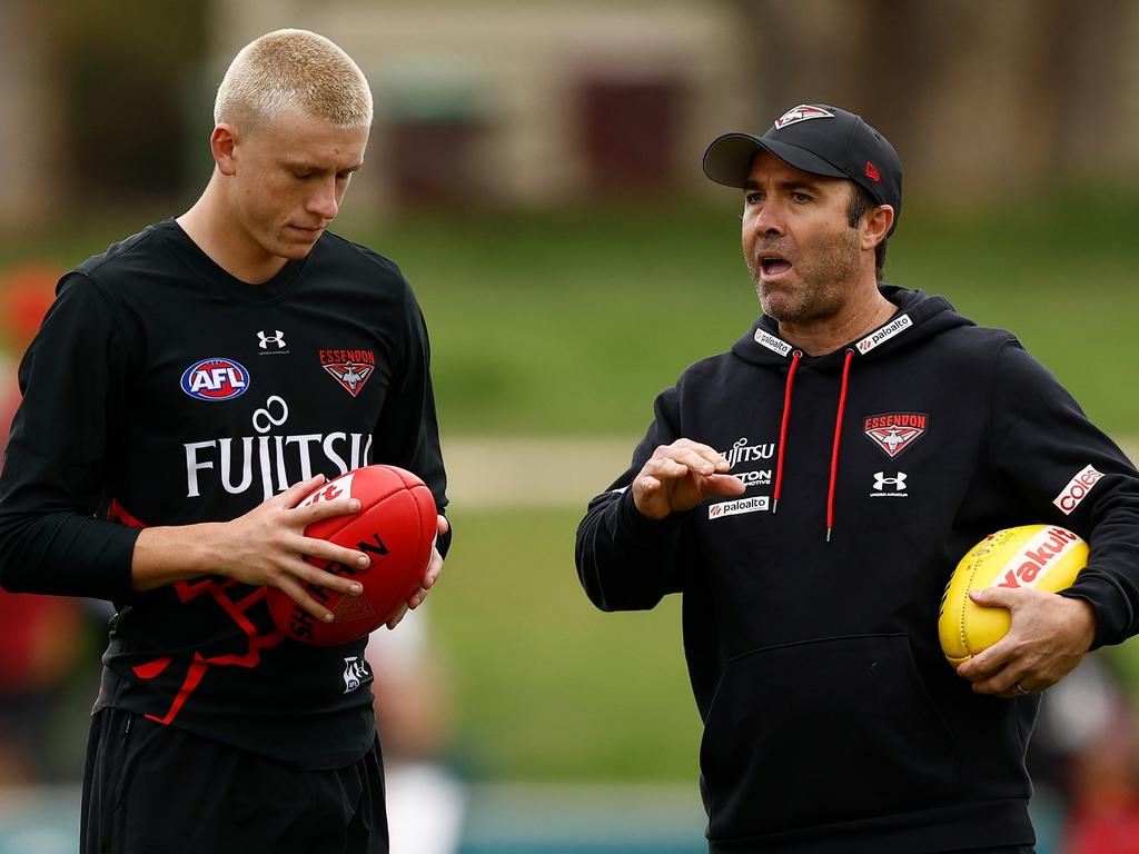 Nate Caddy and Brad Scott chat. (Photo by Michael Willson/AFL Photos via Getty Images)