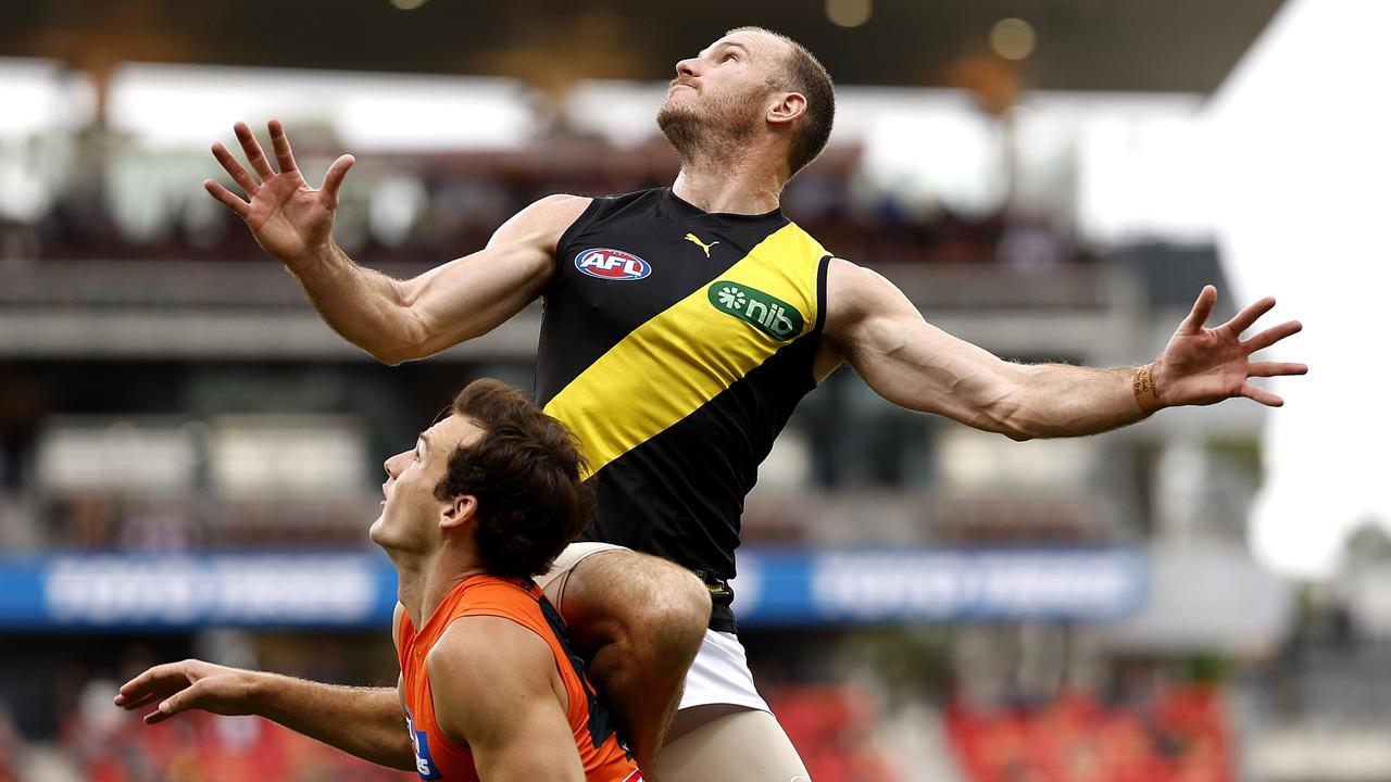 Richmond's [PLAYERCARD]Kamdyn McIntosh[/PLAYERCARD] flies high over Jack Buckley at Giants Stadium. Picture: Phil Hillyard