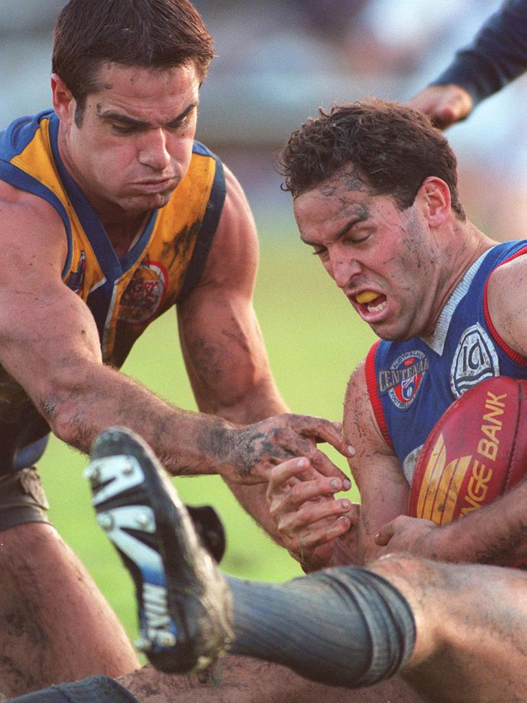Nigel Kellett and Andy Lovell go for the ball in a Footscray v West Coast game in 1996.