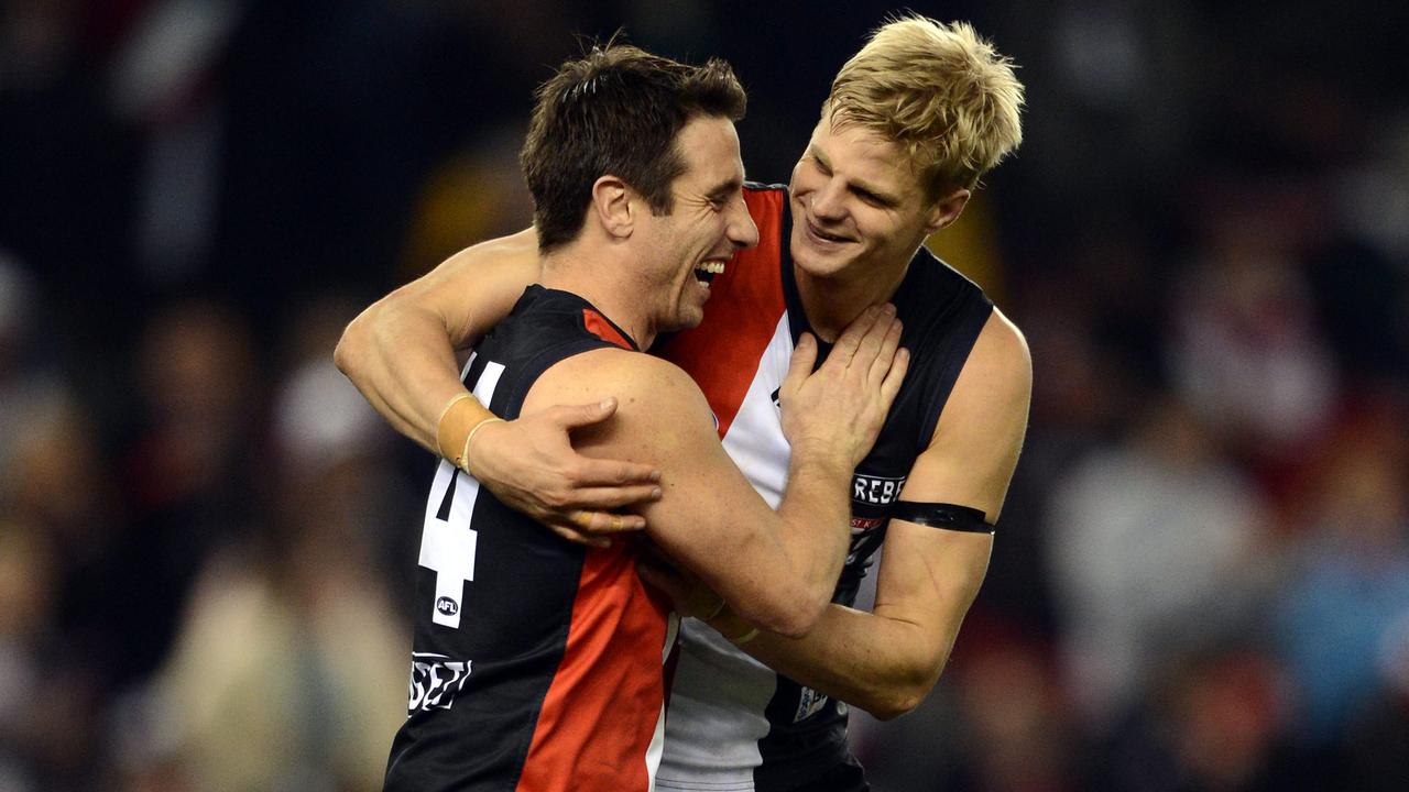 Stephen Milne and Nick Riewoldt celebrate a goal.