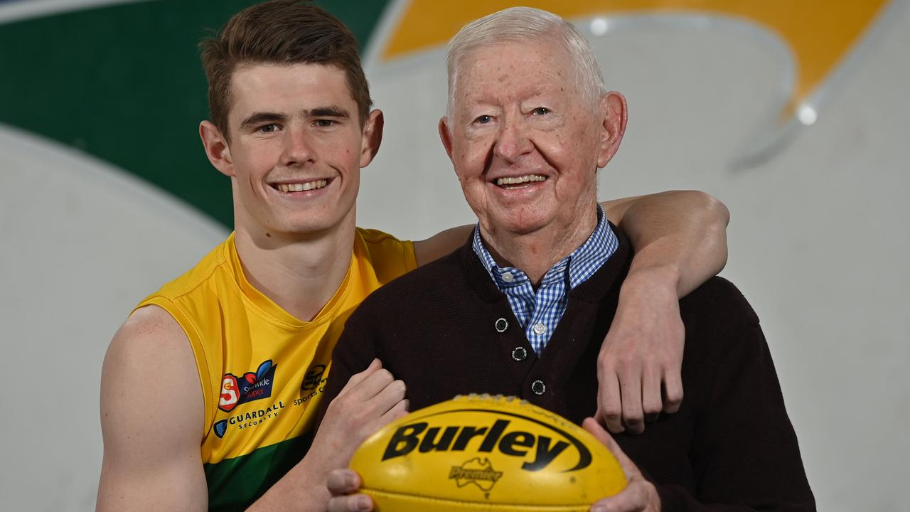 Woodville-West Torrens defender Luke Beecken with his grandfather and legendary SA football administrator John Condon. Picture: Keryn Stevens