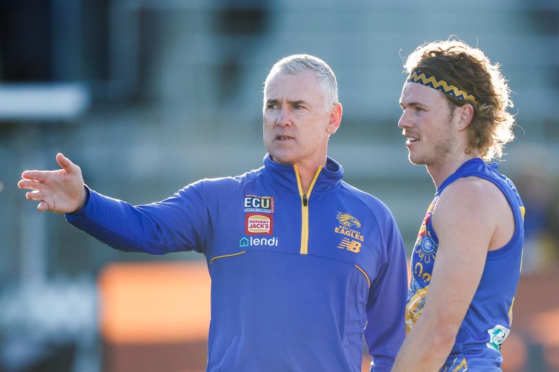 Adam Simpson talks with [PLAYERCARD]Jayden Hunt[/PLAYERCARD] during last weekend’s loss to Hawthorn.