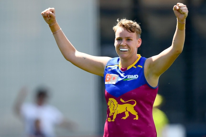 A Brisbane Lions AFLW player celebrates a goal in the grand final against the Kangaroos.
