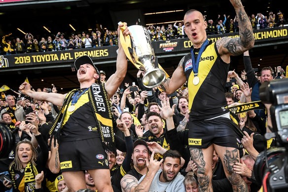 [PLAYERCARD]Liam Baker[/PLAYERCARD] (left) celebrates the Tigers’  2019 premiership with star teammate Dustin Martin.