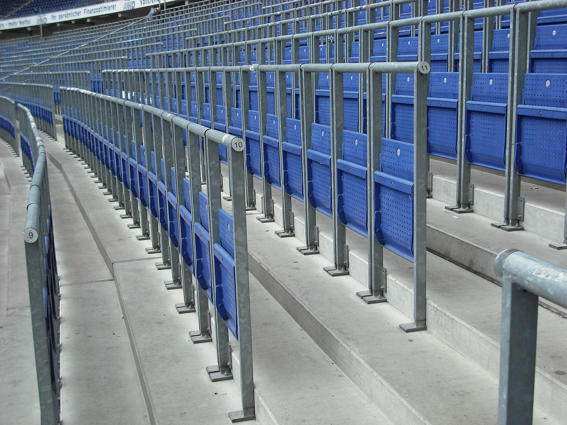 1920px-Safe_standing_area_fitted_with_rail_seats.jpg