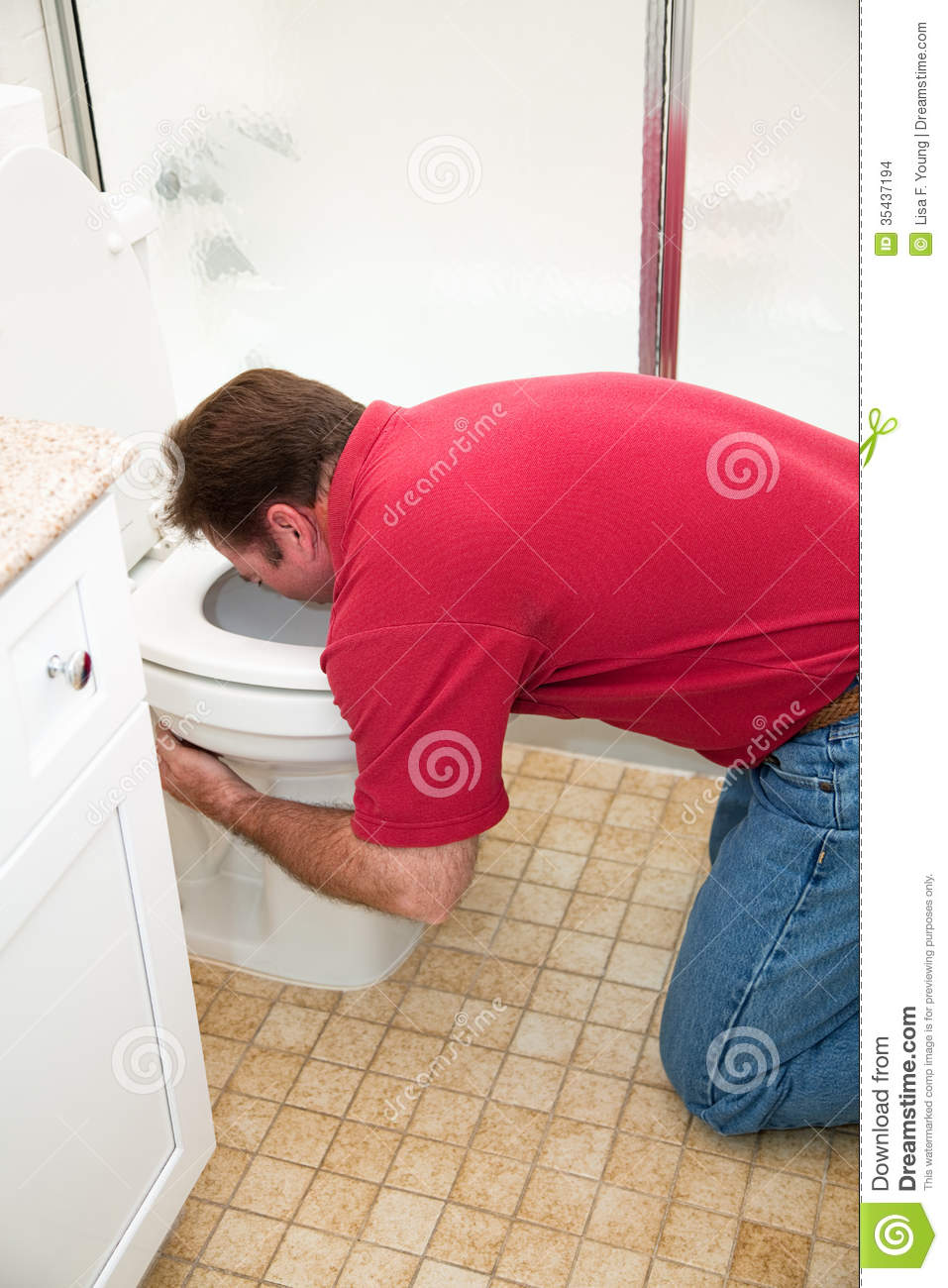man-vomiting-toilet-kneeling-down-bathroom-35437194.jpg