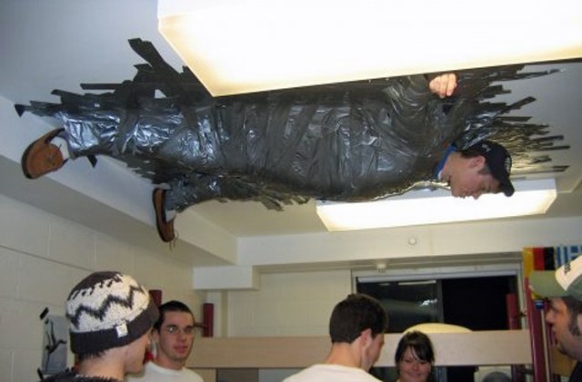 crazy-funny-university-prank-duct-tape-guy-ceiling.jpg