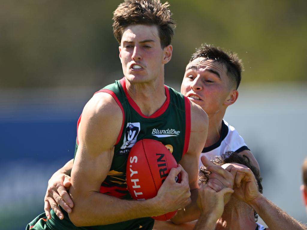 Tasmania Devils ruckman Max Mapley enjoys a first hitout in the VFL. (Photo by Steve Bell/Getty Images)