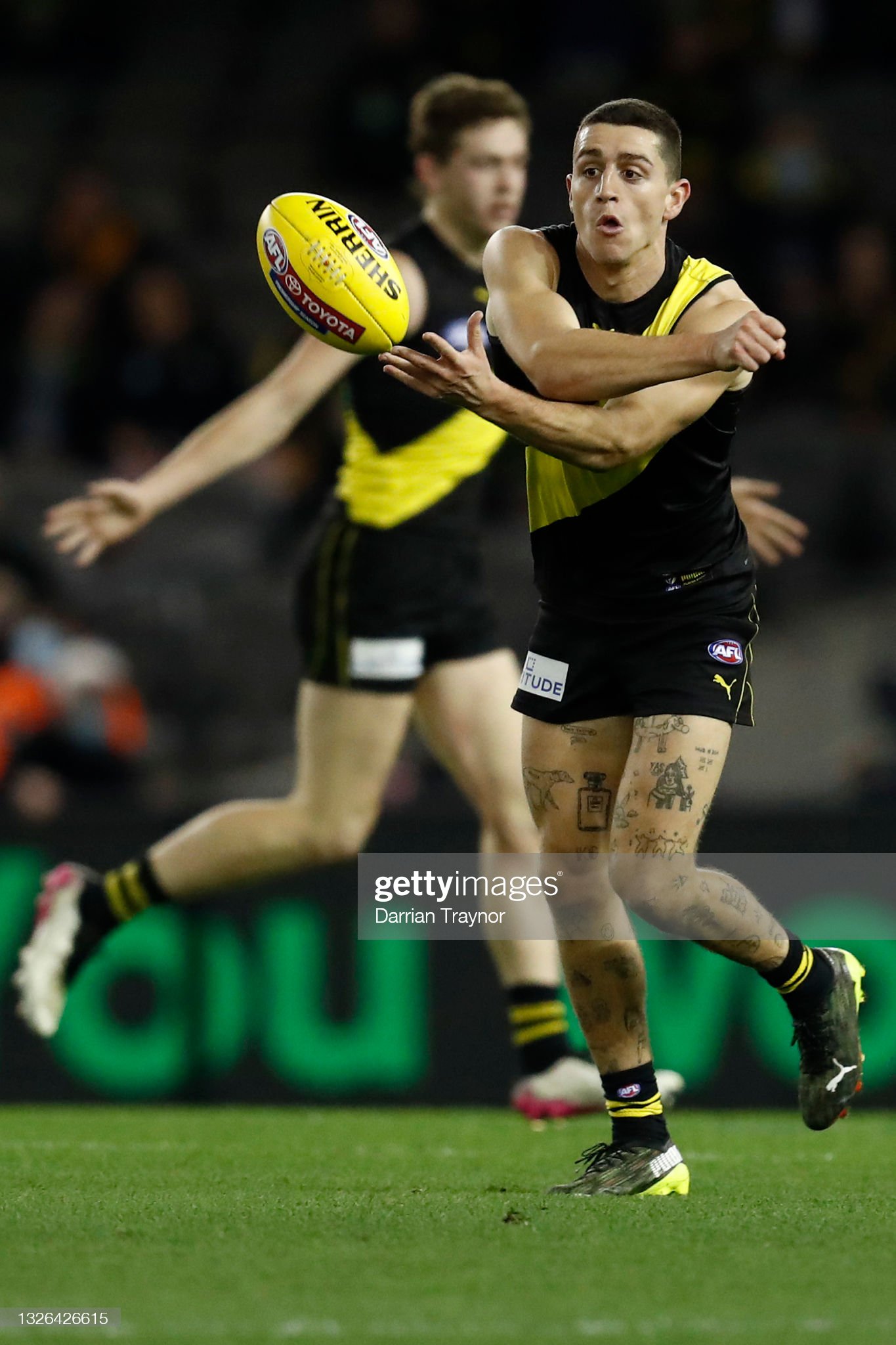 jason-castagna-of-the-tigers-handballs-during-the-round-16-afl-match-picture-id1326426615