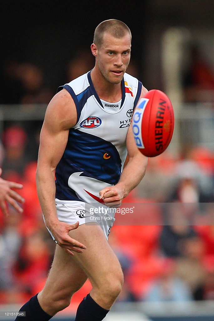 121513545-scott-thompson-of-the-crows-handballs-during-gettyimages.jpg