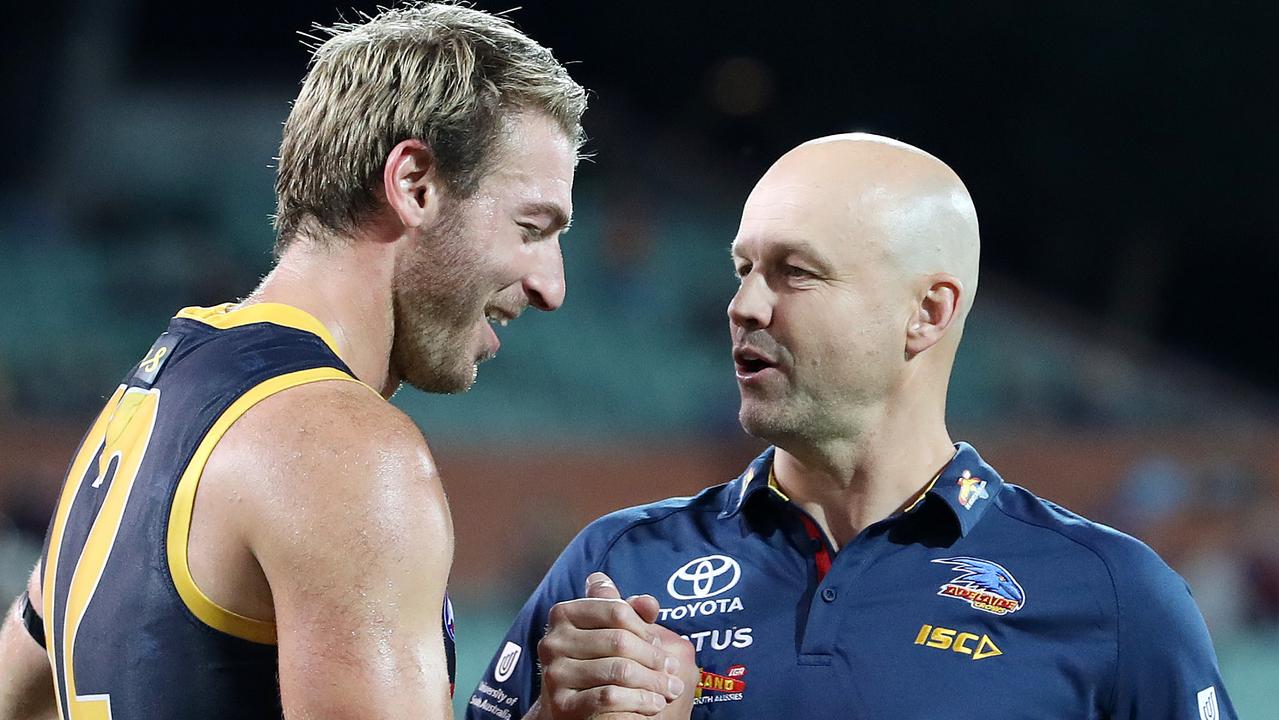 Crows coach Matthew Nicks congratulates Daniel Talia after his 200th game in 2020 at Adelaide Oval against Richmond. Picture: Sarah Reed