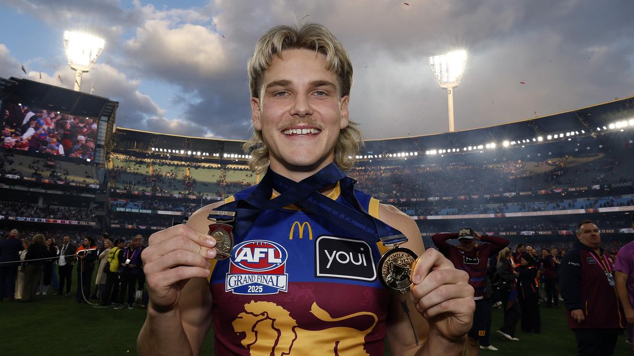 Will Ashcroft of the Lions poses with his 2025 premiership medal and Norm Smith Medal (Photo by Darrian Traynor/Getty Images)