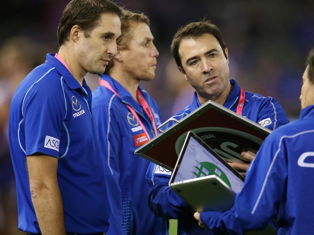 AFL Round 10. Round 10. Western Bulldogs v North Melbourne at Marvel Stadium. Brad Scott, senior coach of the Kangaroos and Cameron Joyce at qtr time. Pic: Michael Klein.