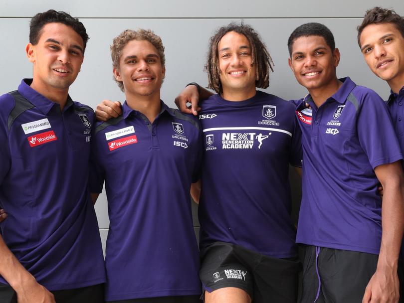Fremantle Dockers Next Generation Academy coach [PLAYERCARD]Tendai Mzungu[/PLAYERCARD] with young recruits, left to right, [PLAYERCARD]Jason Carter[/PLAYERCARD], Liam Henry, Isaiah Butters and Leno Thomas.