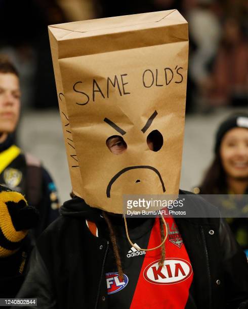 a-disappointed-essendon-supporter-is-seen-during-the-2022-afl-round-10-match-between-the.jpg