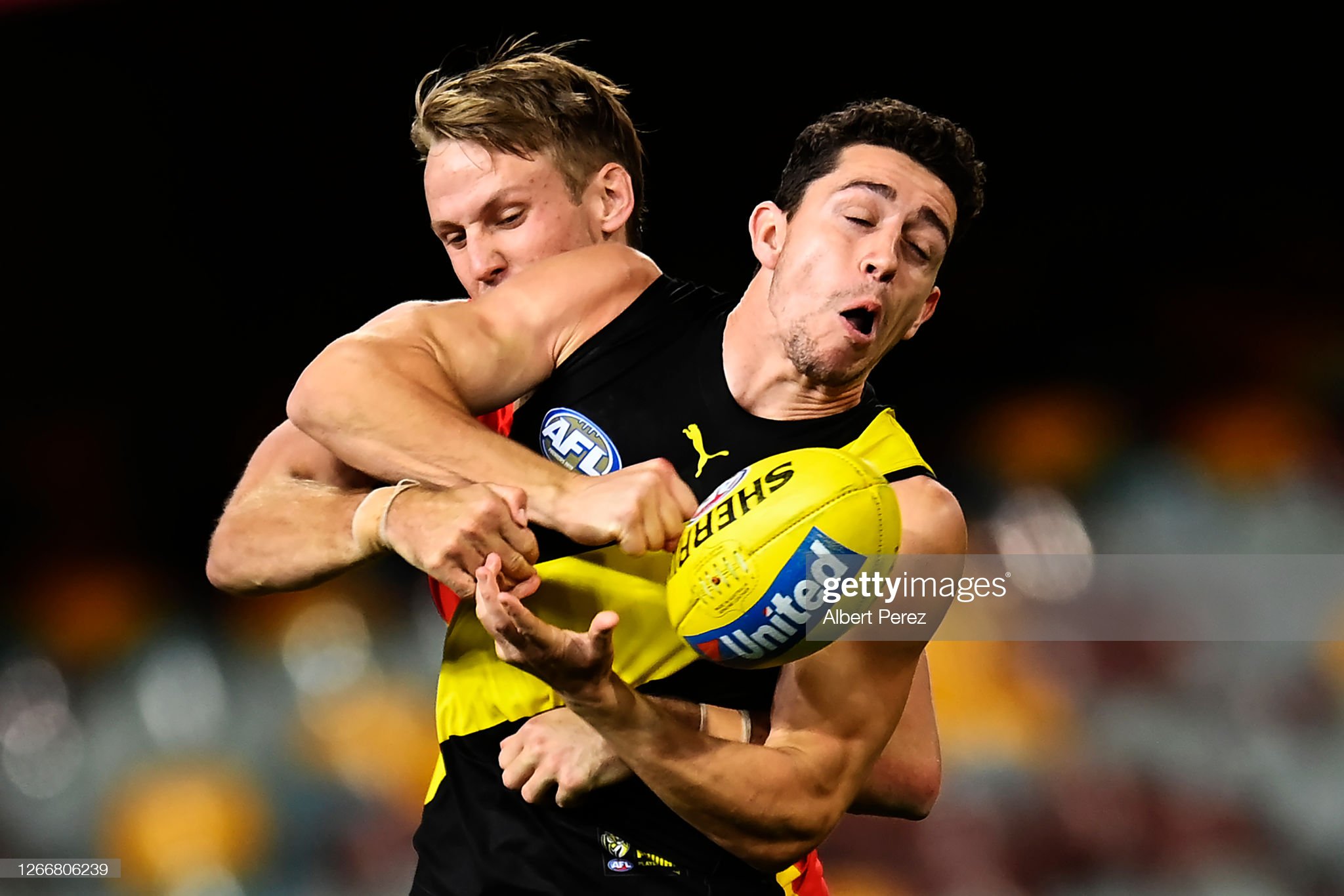 jason-castagna-of-the-tigers-is-tackled-during-the-round-12-afl-match-picture-id1266806239