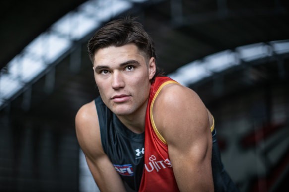 Sam Durham, one of the league’s most improved players in 2024, in Essendon’s specially designed jumper sporting the logo of cancer charity partner Challenge the club is wearing for their annual Tackling Childhood Cancer Game.