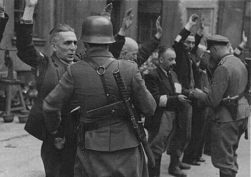 german-soldiers-arrest-jews-ghetto-warsaw-uprising-1943.jpg