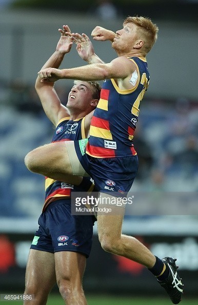 465941886-kyle-cheney-of-the-crows-jumps-to-punch-the-gettyimages.jpg