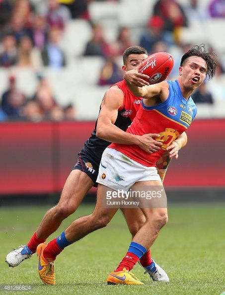 481286824-allen-christensen-of-the-lions-is-tackled-by-gettyimages.jpg