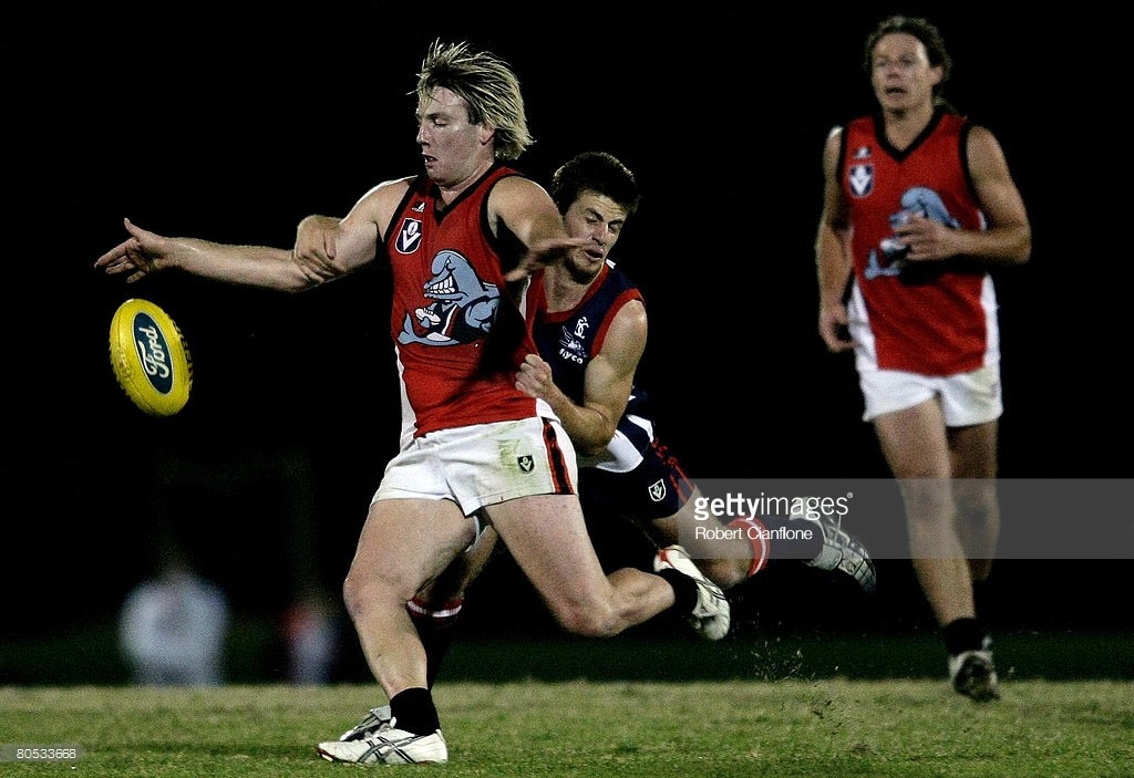 80533668-curtis-baker-of-the-dolphins-is-tackled-by-gettyimages.jpg