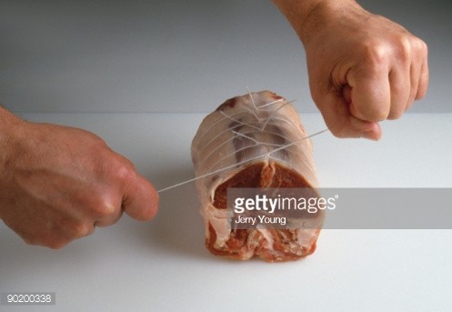 90200338-hands-tying-string-around-saddle-of-lamb-gettyimages.jpg