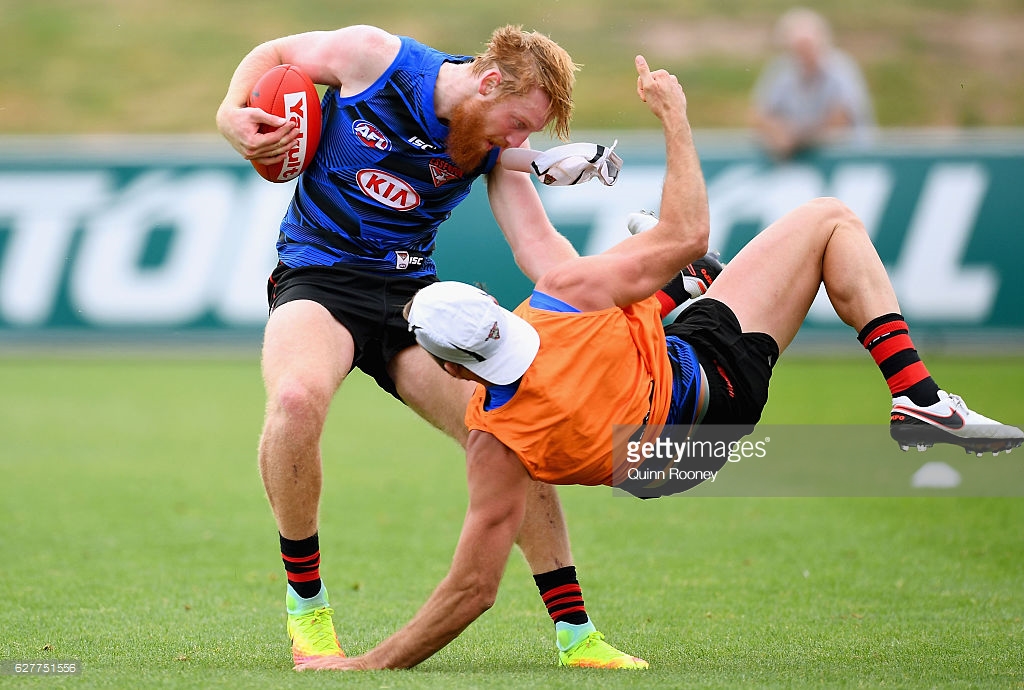 aaron-francis-of-the-bombers-is-tackled-by-cale-hooker-during-an-picture-id627751556