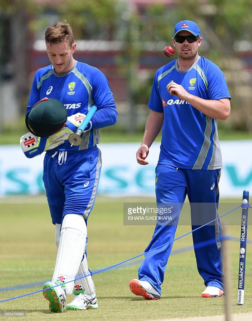 australian-cricketer-jon-holland-walks-with-australian-wicketkeeper-picture-id585470668