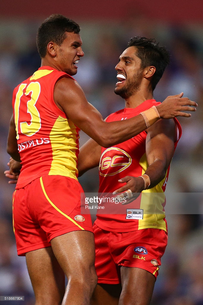 callum-ah-chee-and-aaron-hall-of-the-suns-celebrate-a-goal-during-the-picture-id518667804