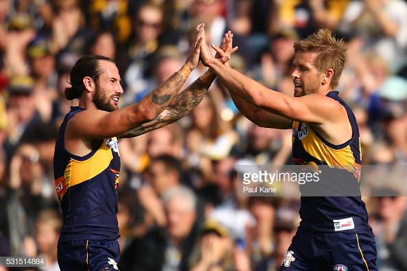 chris-masten-and-mark-lecras-of-the-eagles-celebrate-a-goal-during-picture-id531514884