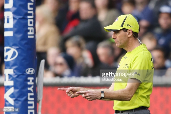 goal-umpire-signals-a-goal-during-the-round-21-afl-match-between-the-picture-id484954046