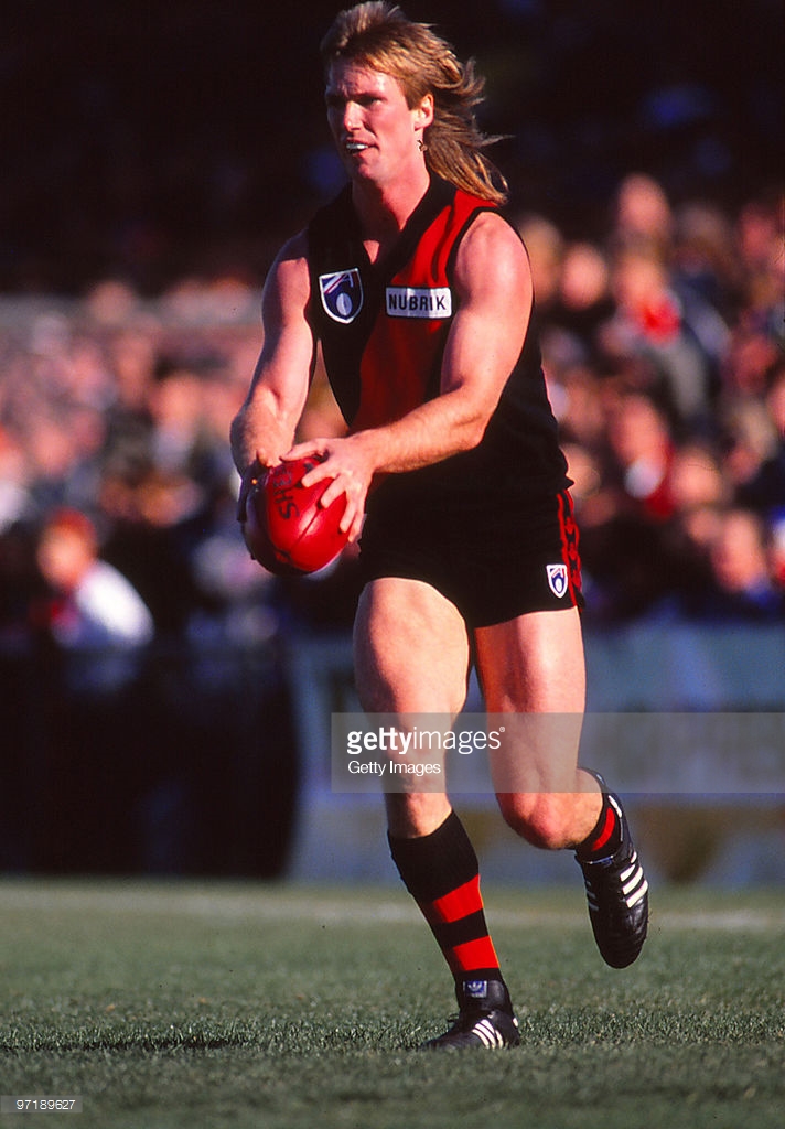 greg-anderson-of-the-essendon-bombers-kicks-during-a-afl-match-in-picture-id97189627
