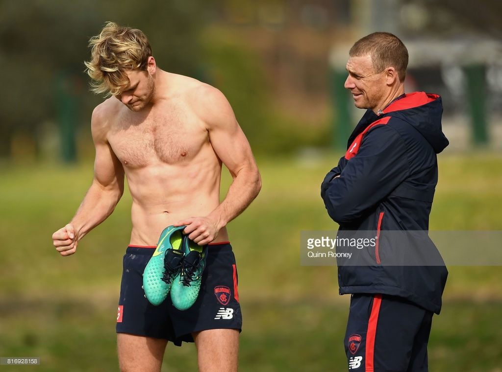 jack-watts-of-the-demons-speaks-to-head-coach-simon-goodwin-during-a-picture-id816928158