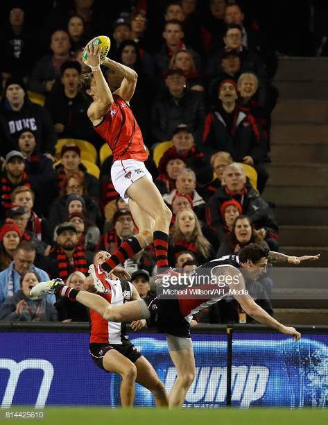joe-daniher-of-the-bombers-takes-a-spectacular-mark-over-jake-of-the-picture-id814425610