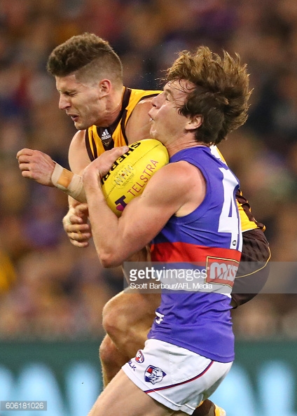 liam-picken-of-the-bulldogs-and-luke-breust-of-the-hawks-smash-into-picture-id606181026